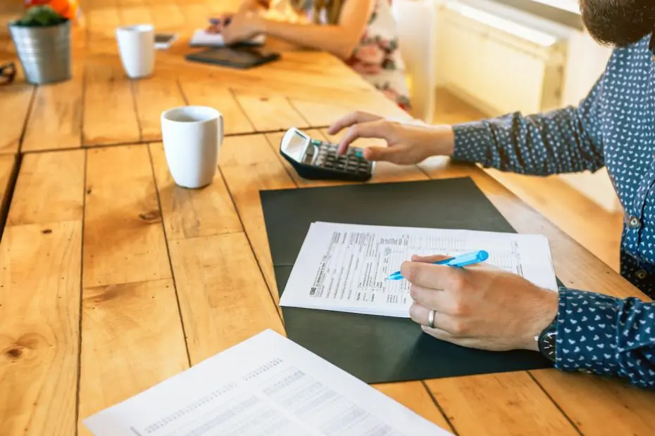 Accountant filling in tax documents in office